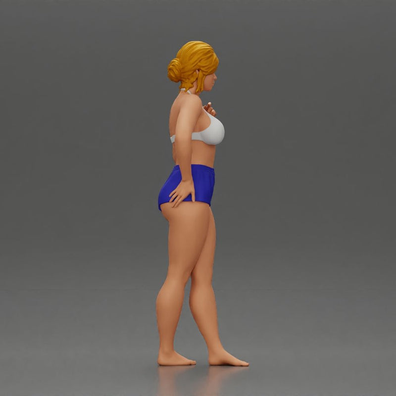 woman posing barefoot wearing bikini top and shorts stylishly - Only-Games