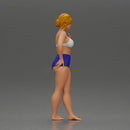 woman posing barefoot wearing bikini top and shorts stylishly - Only-Games