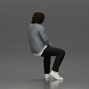 Man in Casual Sweater and Sneakers Sitting with Relaxed Posture - Only-Games