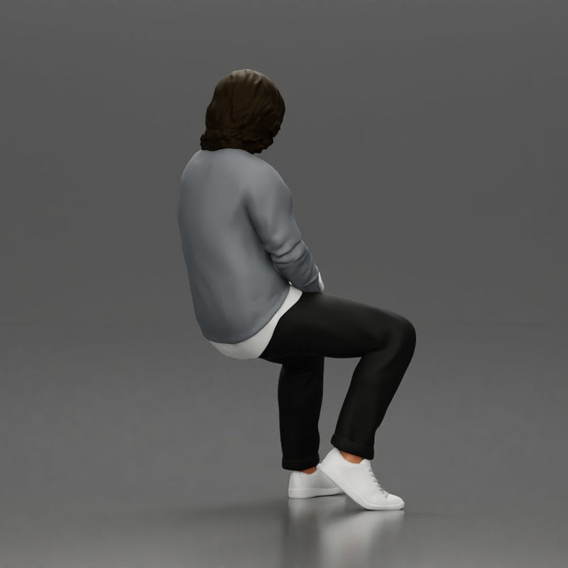 Man in Casual Sweater and Sneakers Sitting with Relaxed Posture - Only-Games