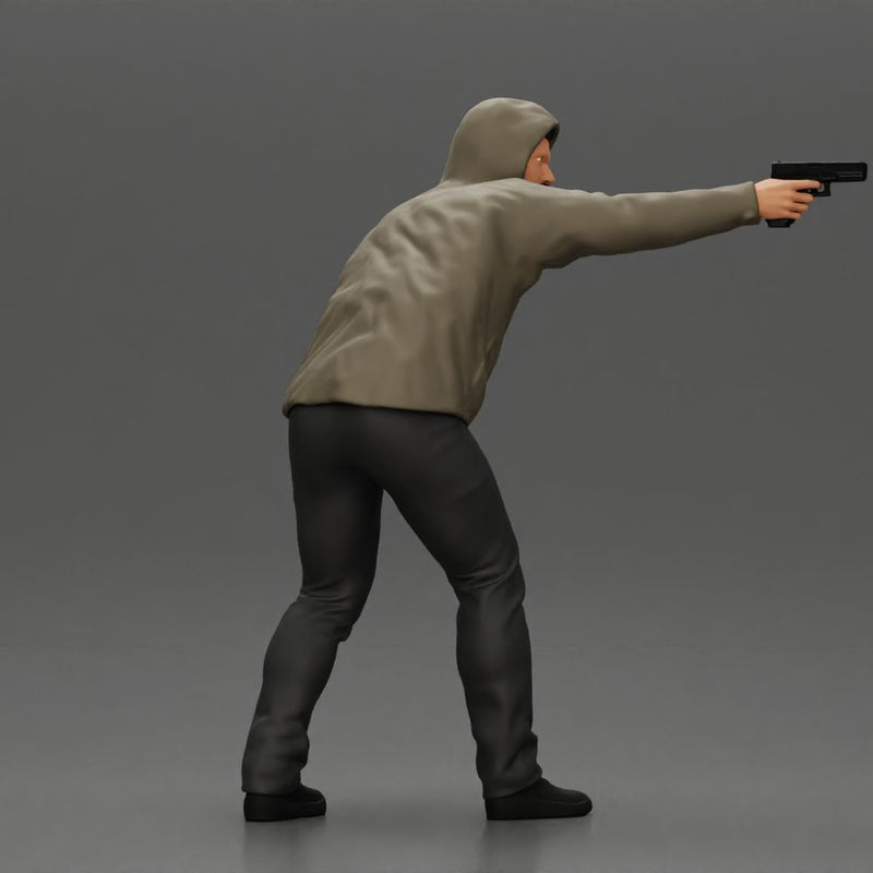 Man in hoodie pointing gun while raising hand in defensive gesture - Only-Games