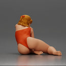 attractive woman in red swimsuit resting calmly on the beach - Only-Games