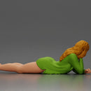 Girl with long hair in green dress lying with calm on the beach - Only-Games