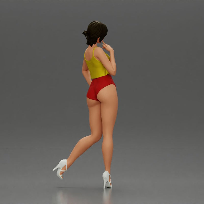 Striking a flirty pose wearing yellow crop top red bottoms - Only-Games