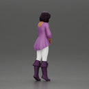 Confident woman in purple top and boots with white leggings - Only-Games