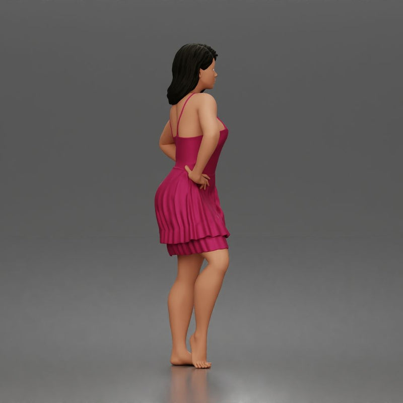 woman posing with hands on hips wearing ruffled dress