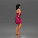woman posing with hands on hips wearing ruffled dress