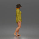 Standing woman In Oversized Button-Shirt With Bucket Hat Barefoot