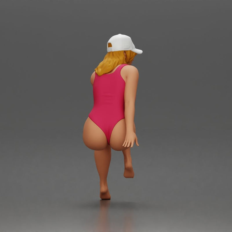 Woman in Swimsuit and Cap Sitting Thoughtfully in Relaxed Pose - Only-Games