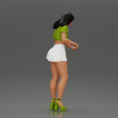 woman standing with a green top white skirt looking like they want to hold something - Only-Games