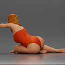 attractive woman in red swimsuit resting calmly on the beach - Only-Games