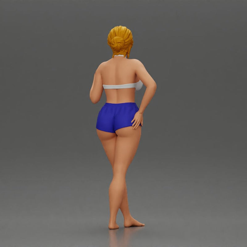 woman posing barefoot wearing bikini top and shorts stylishly - Only-Games