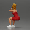 Stylish woman in red dress and sneakers striking dynamic pose - Only-Games