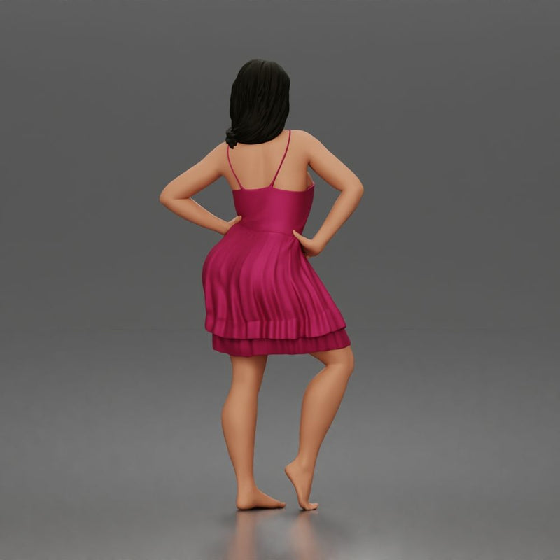 woman posing with hands on hips wearing ruffled dress