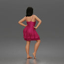 woman posing with hands on hips wearing ruffled dress