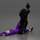 Batman dragging Joker by leg after defeating him in battle - Only-Games