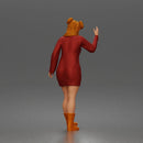 Cheerful Girl Waving Confidently in Stylish Dress and Boots