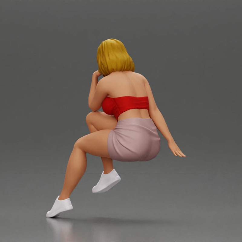 Confident Blonde Woman Sitting Gracefully in Red and Pink - Only-Games