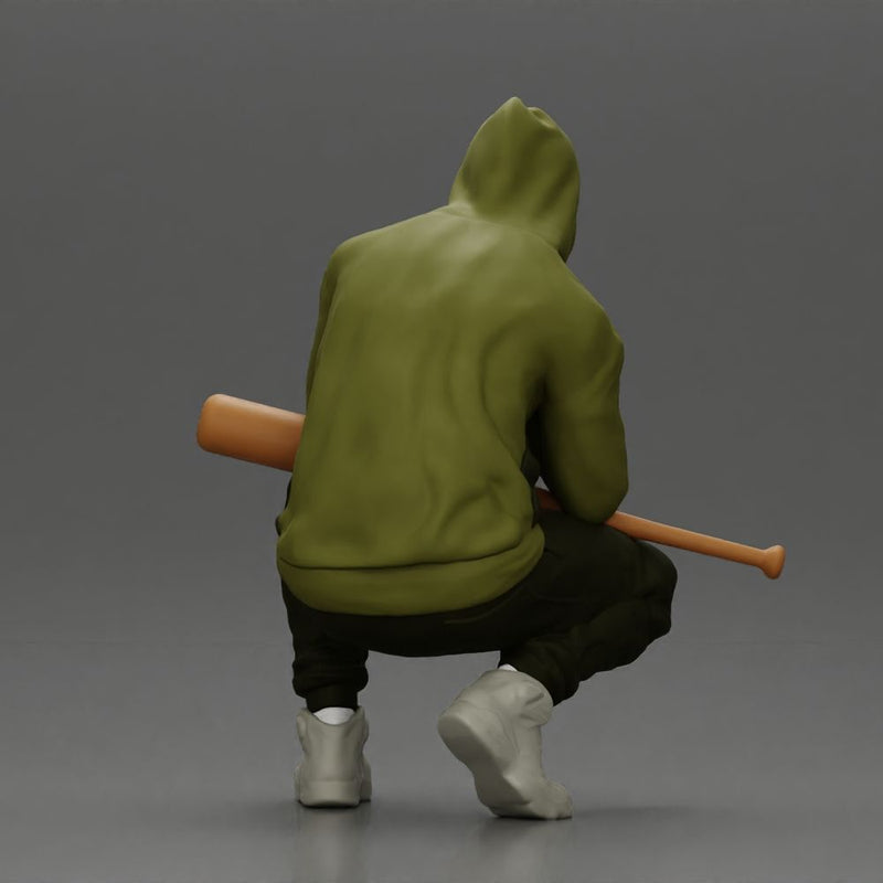 Gangster crouching low in green hoodie holding bat planning move - Only-Games