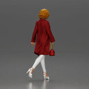Woman with curly hair wearing red coat walking holding red handbag - Only-Games