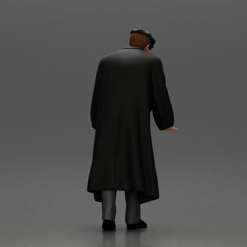 Man in black coat wearing flat cap standing with serious expression - Only-Games