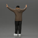 Man wearing hoodie and beanie raises hands looking happy in relaxed stance - Only-Games