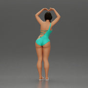 Brunette woman in turquoise swimsuit stretching with elegant ballet pose - Only-Games