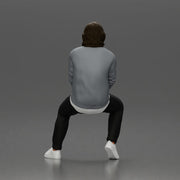 Man in Casual Sweater and Sneakers Sitting with Relaxed Posture - Only-Games