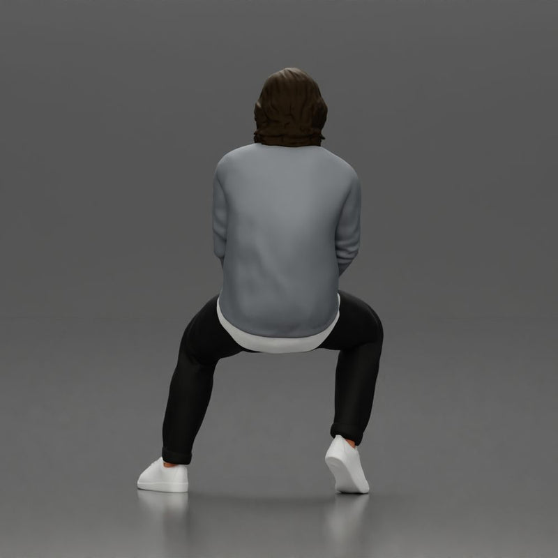 Man in Casual Sweater and Sneakers Sitting with Relaxed Posture - Only-Games