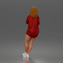 leaning woman folds arms open shirt swimwear bottoms and sneakers