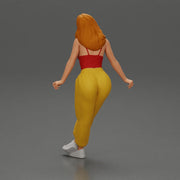 Woman sitting on car in red top yellow pants striking playful pose - Only-Games