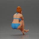 Woman sitting in Blue Bikini Ponders with Relaxed Posture - Only-Games