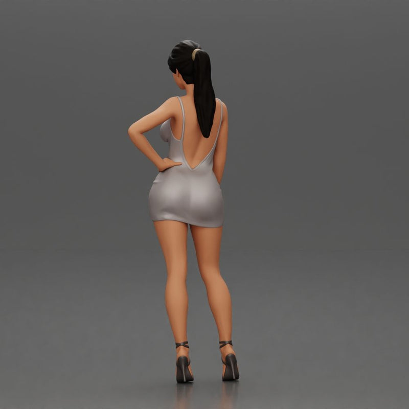 Woman in silver mini dress posing with hand on hip - Only-Games