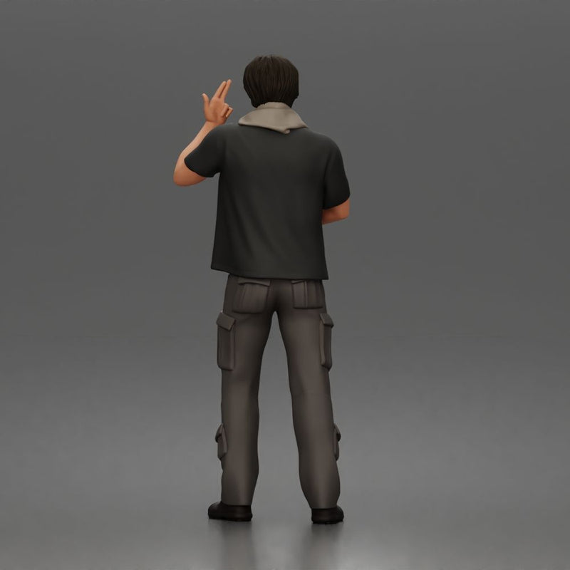 Man Standing With Handgun And Peace Sign In T-Shirt Scarf Cargo Pants And Boots