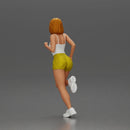 Woman with short hair wearing white top and yellow shorts running - Only-Games