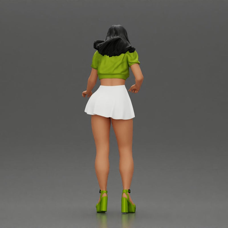 woman standing with a green top white skirt looking like they want to hold something - Only-Games