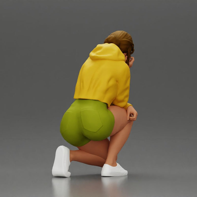 Performer crouching thoughtfully in yellow jacket green shorts white sneakers - Only-Games