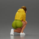 Performer crouching thoughtfully in yellow jacket green shorts white sneakers - Only-Games