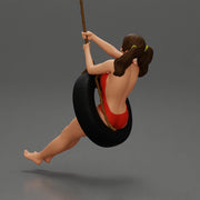 Sexy Girl in onepiece Enjoying a Fun Swinging Adventure on Tire - Only-Games