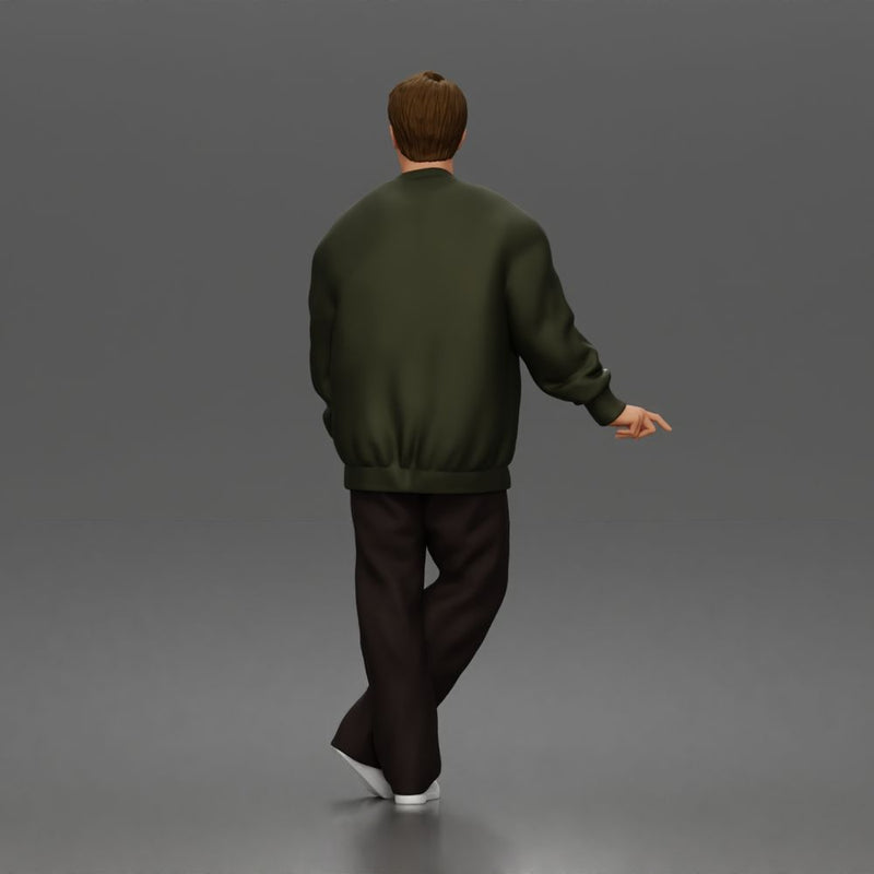 Man standing In Bomber Jacket Tee Trousers Sneakers And Sunglasses