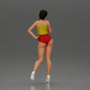 Striking a flirty pose wearing yellow crop top red bottoms - Only-Games