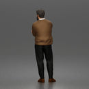 Man Standing Calmly in Casual Cardigan and Dress Pants