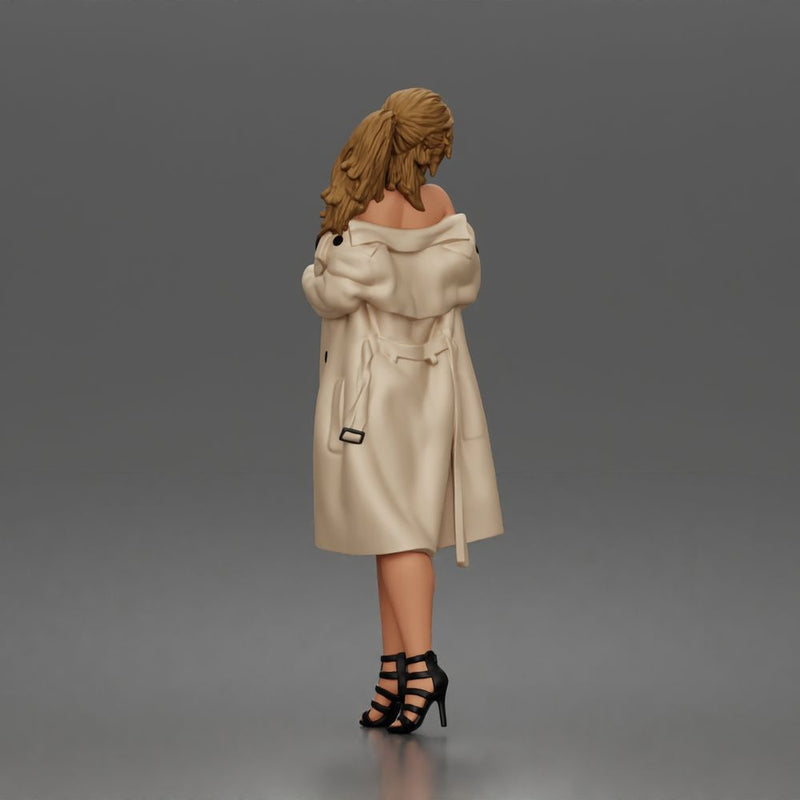 Woman Posing In Strapless Bodysuit With Long Coat And High Heel Sandals