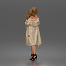 Woman Posing In Strapless Bodysuit With Long Coat And High Heel Sandals