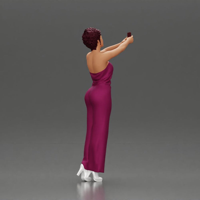 Fashionable woman in a jumpsuit snapping a selfie in style - Only-Games