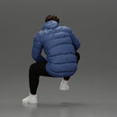 Street performer crouching low in blue puffer jacket athletic stance sitting - Only-Games