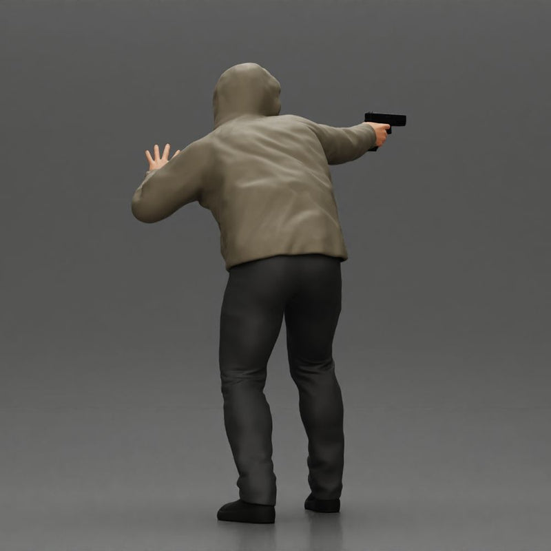 Man in hoodie pointing gun while raising hand in defensive gesture - Only-Games