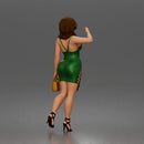 Elegant Woman Walking Confidently in Glamorous Dress, Heels, and Handbag