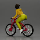 Sporty girl riding a red bike in bright yellow tracksuit - Only-Games