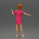 Woman in pink dress dancing joyfully with raised arms sideways - Only-Games